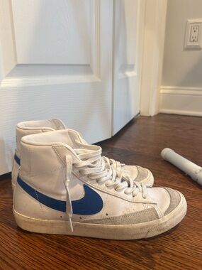 Nike White High-Top Sneakers with Blue Swoosh